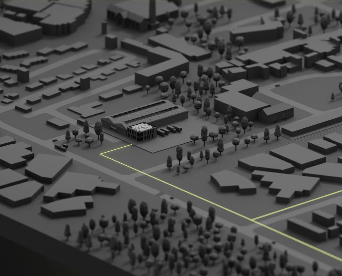 3D Modell einer Industriezone mit Gebäuden, Wegen und grünen Leitung als Teil einer Breitband Lösung